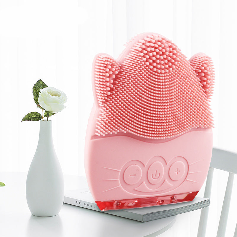 Electric facial cleanser with soft silicone bristles