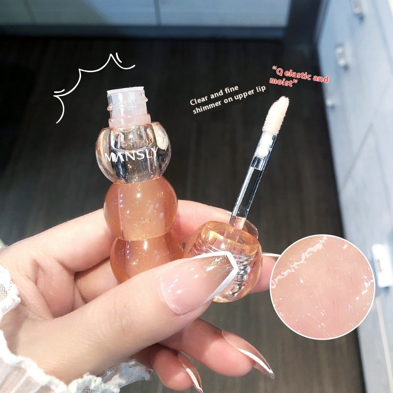 Close-up of lips wearing natural moisturizing lip gloss with glossy finish