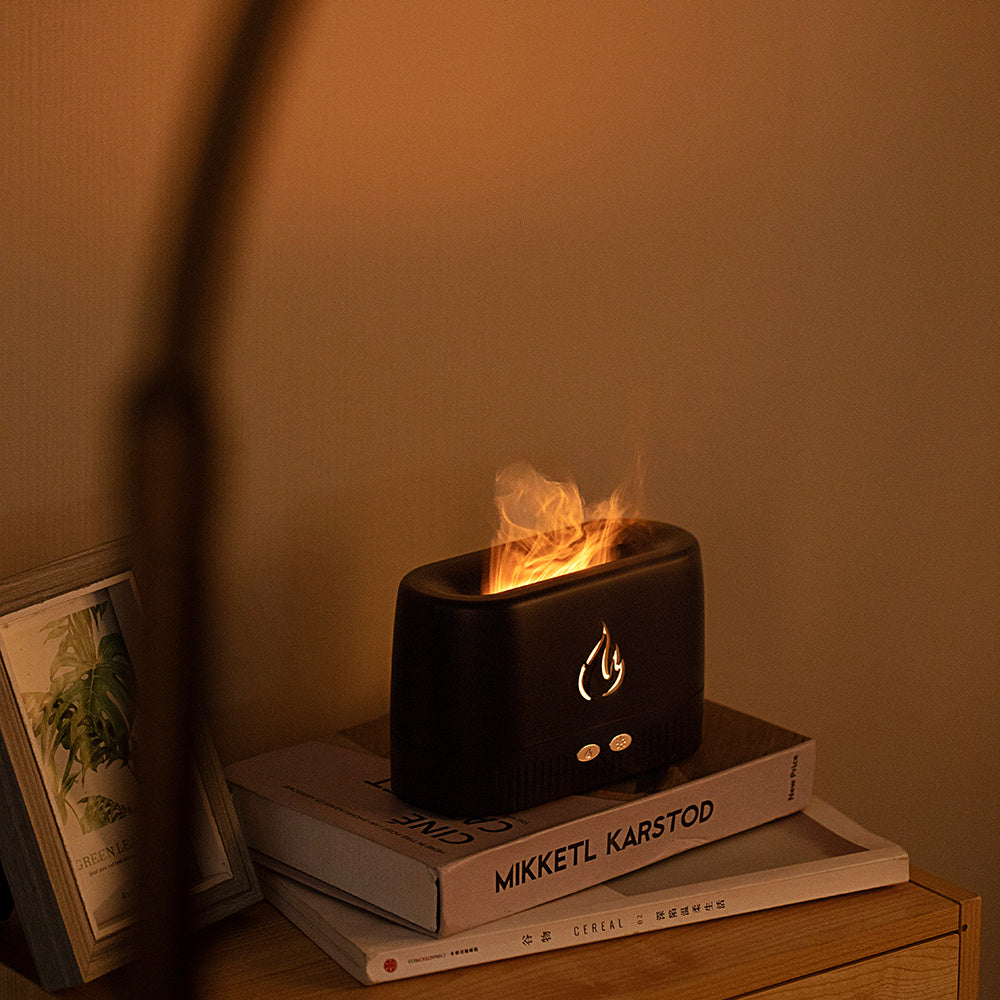 Modern Flame Diffuser with Essential Oils Beside It